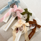 Ivory Velvet Bow Cross Candles