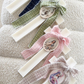 Ivory Cross Candle with Tweed Bow