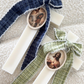 Ivory Cross Candle with Tweed Bow