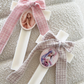 Ivory Cross Candle with Tweed Bow